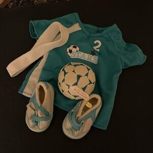 American girl, soccer T-shirt, headband, sneakers, and ball